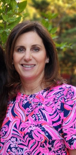 A close-up of a person smiling
Description automatically generated